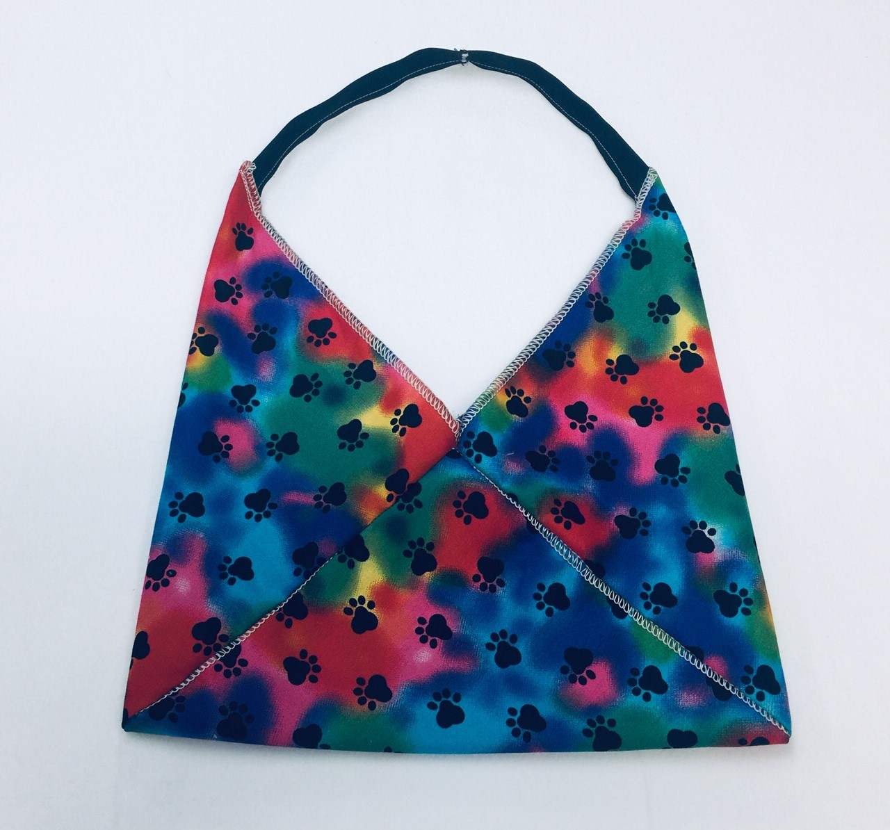 Small origami cotton bag kit with blue pink and green tie dye and black paw print pattern