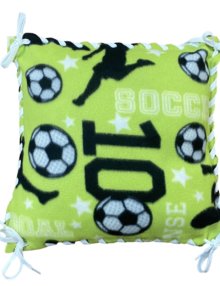 soccer pattern in lime green with white and black soccer balls and black and white lettering, with white ribbon