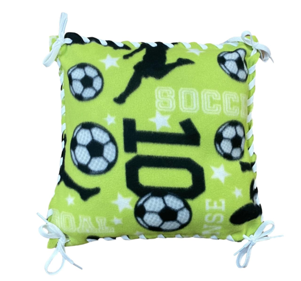 soccer pattern in lime green with white and black soccer balls and black and white lettering, with white ribbon