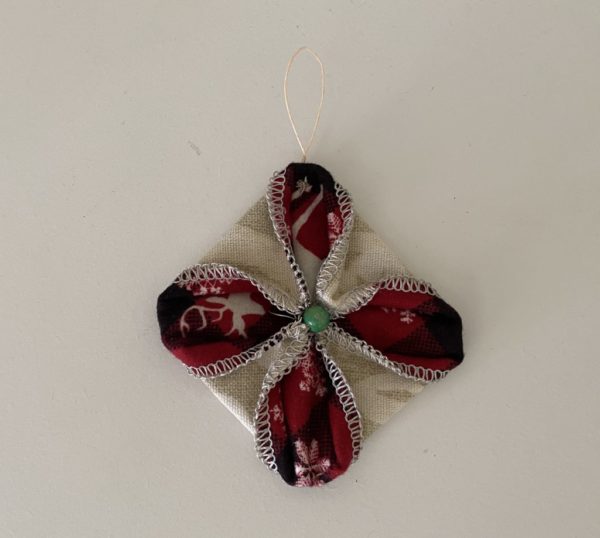Christmas Ornament - Fabric Star Ornament made from two 5 inch squares with Bone colored outer fabric and Red colored inner fabric, small green bead in center and small loop to hang