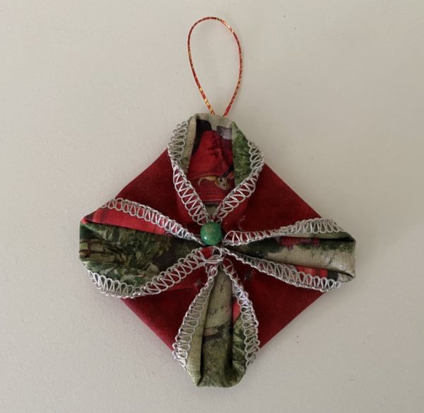 Christmas Ornament - Fabric Star Ornament made from two 5 inch squares with Red colored outer fabric and Green colored inner fabric, small green bead in center and small loop to hang