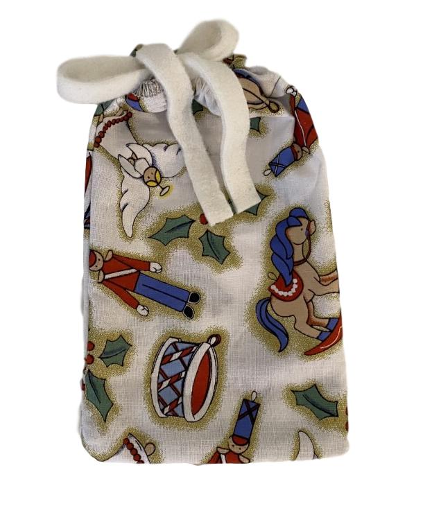 4.5 x 7 inch cotton small drawstring gift bag with white and gold background, toy soldiers, drums, angels and rocking horses in tan, red, blue and white