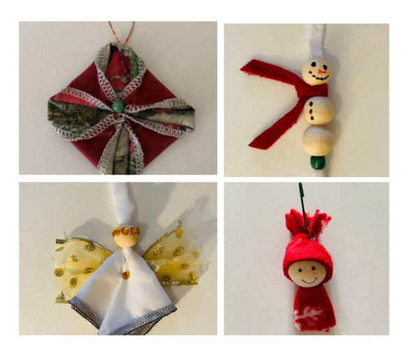 Picture of 4 Christmas Ornaments in kit, includes one fabric folding star in red and green, one white wooden snowman with red scarf, one white angel with gold halo and wings, one Child face with red fleece hat and fleece sweater