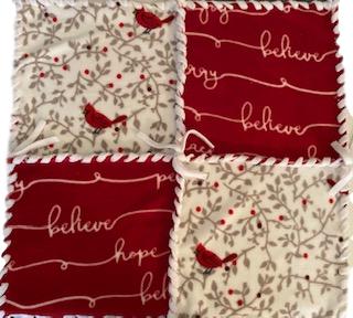This blanket kit uses sixteen 13" fleece squares in a Christmas Cardinal pattern, off white with red cardinals and berries and solid red with white writings of hope, believe, and be merry. 