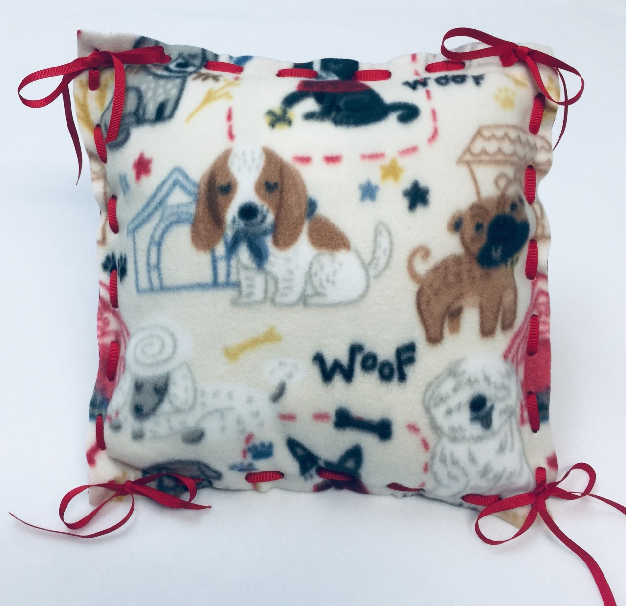 Fleece Pillow Kit with Miscellaneous Dogs, Dog House on off white with brown, gray, and red in pattern