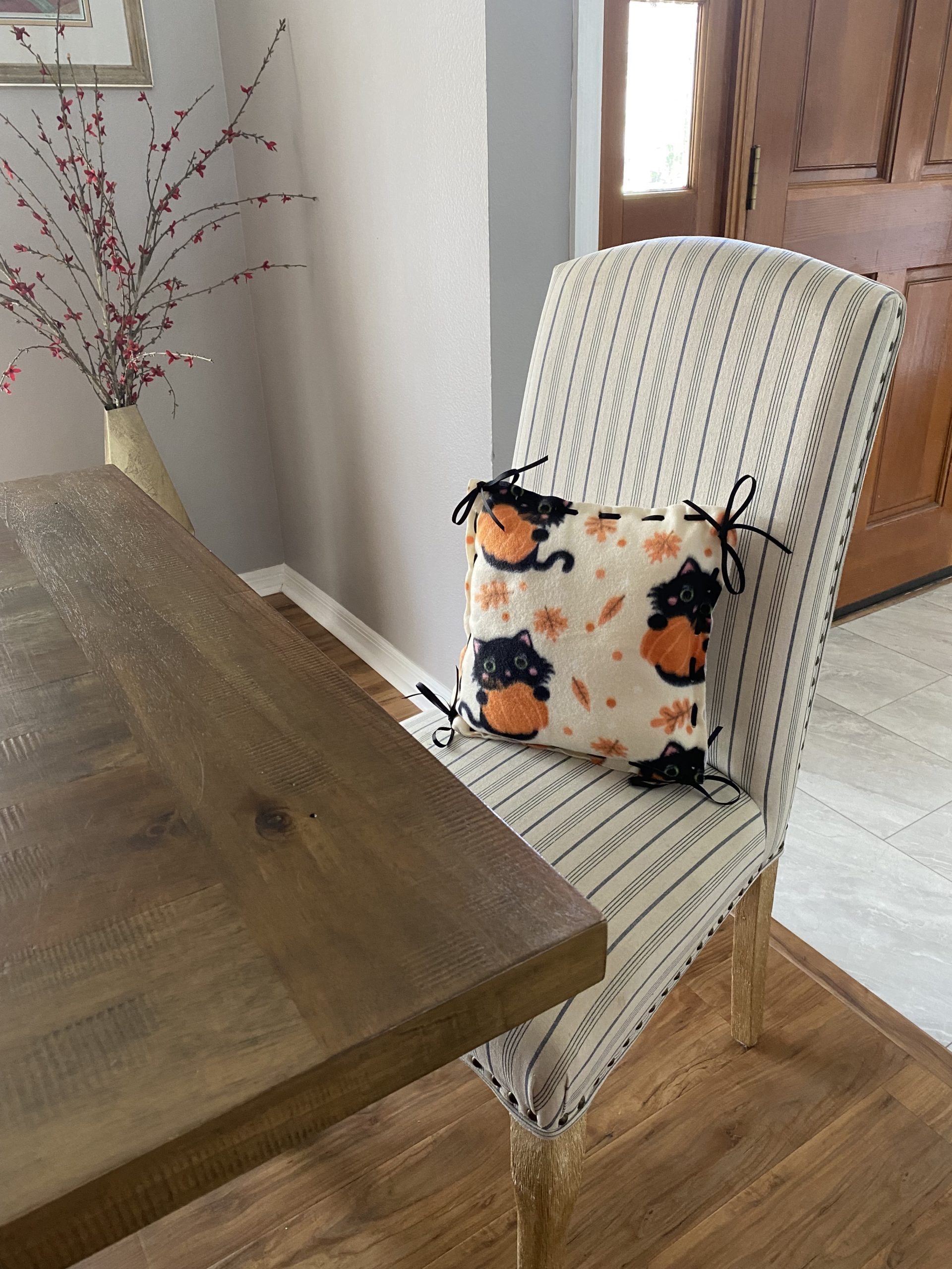 Black cats with pumpkins fleece pillow set in dining room chair