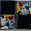 Four patch mug rug kit - 2 navy blue solid squares with 2 bold white, yellow, red and blue floral with white butterfly squares