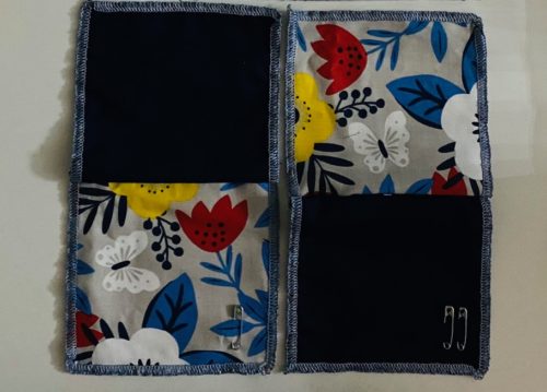 Four patch mug rug kit - 2 navy blue solid squares with 2 bold white, yellow, red and blue floral with white butterfly squares