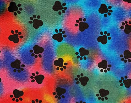 Red blue green and yellow tiedie with black paw prints