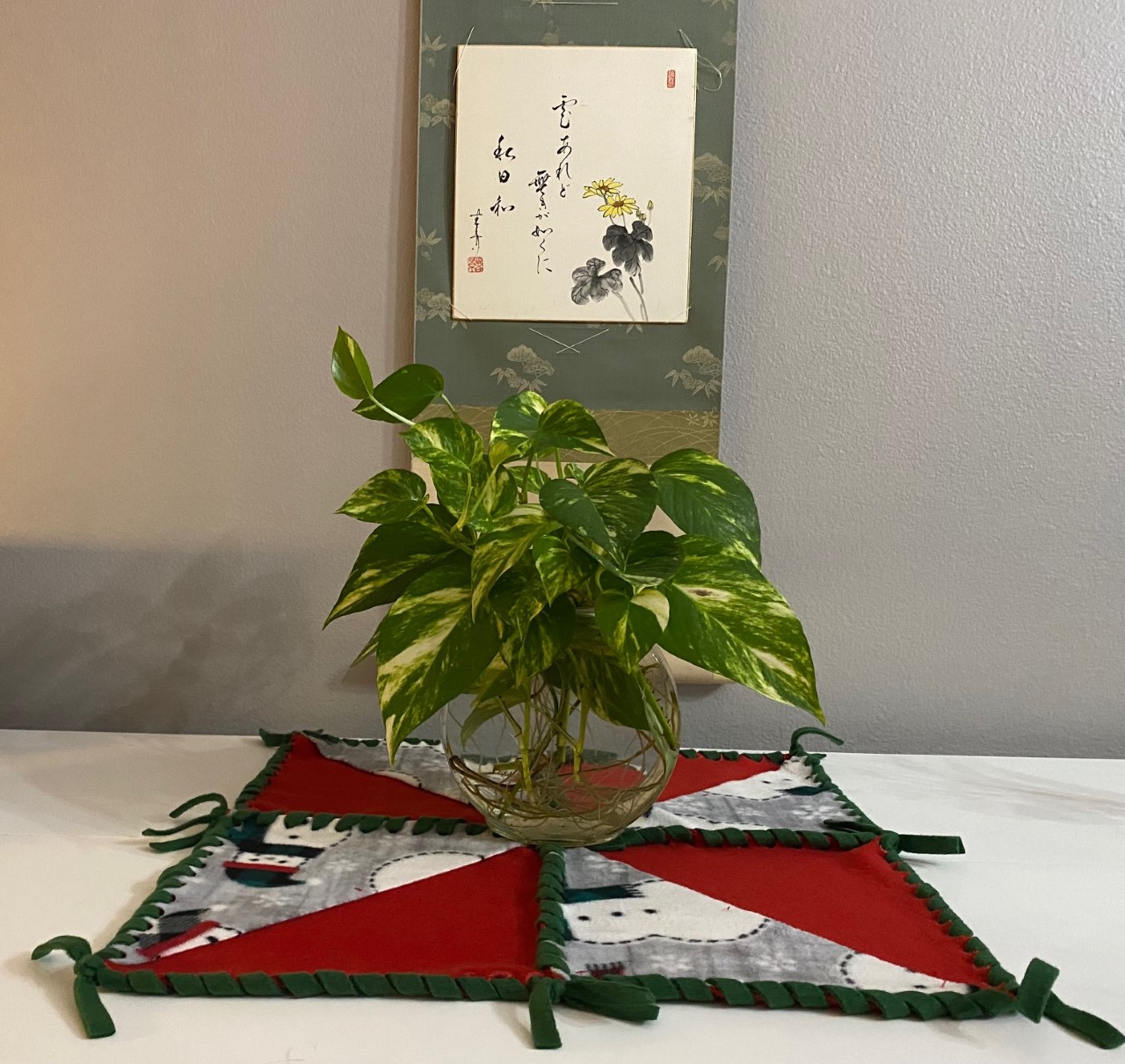 20 inch fleece pinwheel Christmas Table Topper on Desk with plant