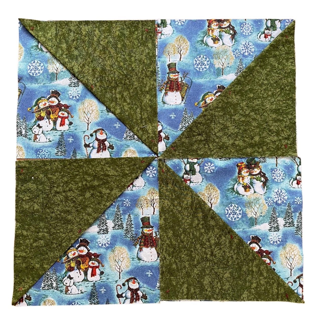 20 inch cotton snowman pinwheel table topper sewing project in light blue, green, white, red