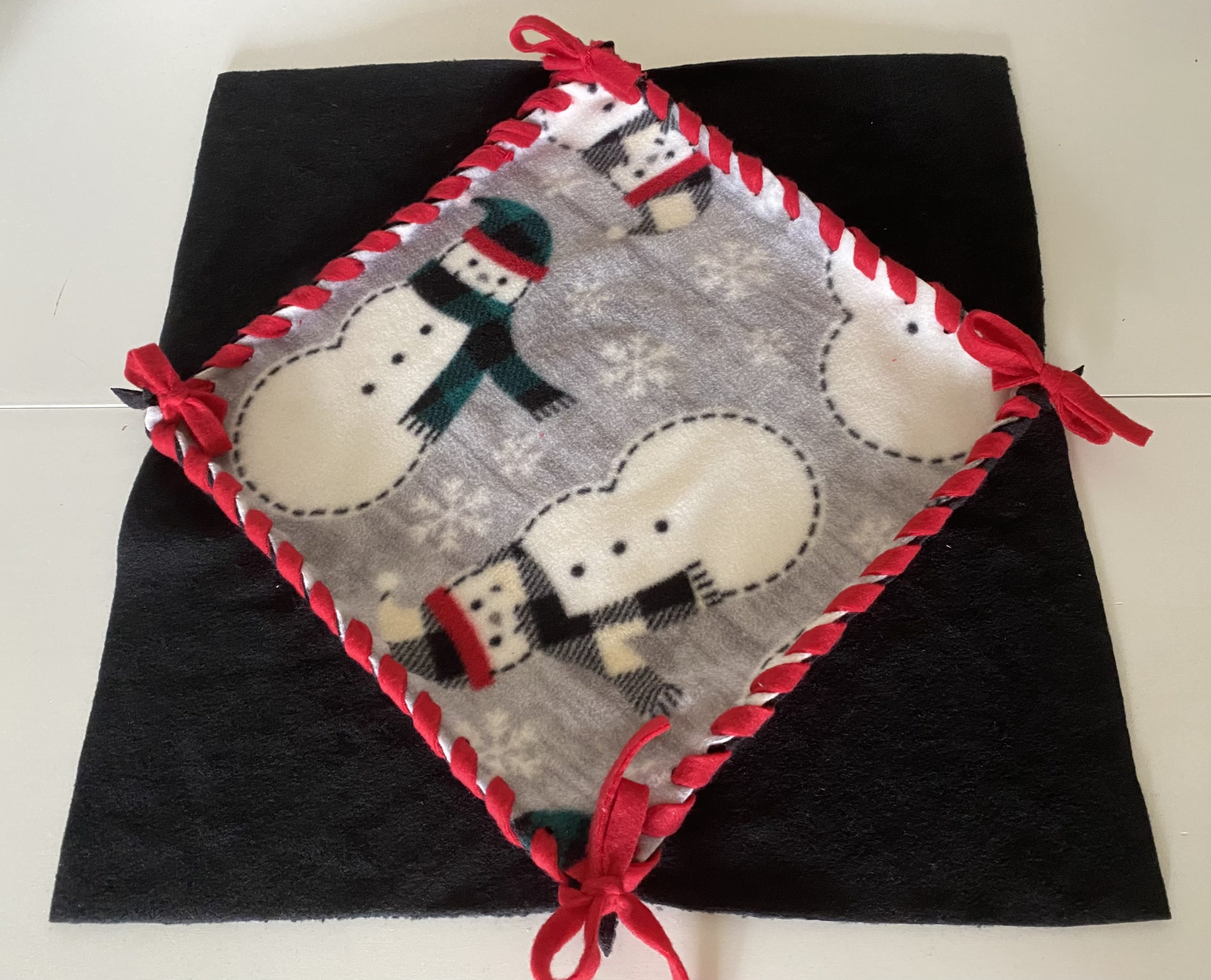 Fleece 18 inch Christmas Diamond Table Topper - Black, Red & Gray with  Snowman Pattern, Red fleece lacing around perimeters - Mitsy Kit